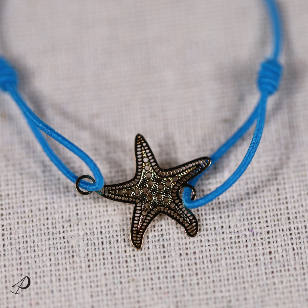 Bracelet élastique Étoile de mer bleu avec pendentif doré