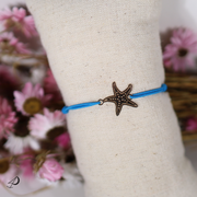 Bracelet élastique Étoile de mer bleu avec pendentif doré