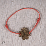Bracelet élastique Trèfle pêche avec pendentif doré