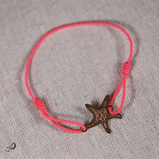 Bracelet élastique Étoile de mer rose avec pendentif doré